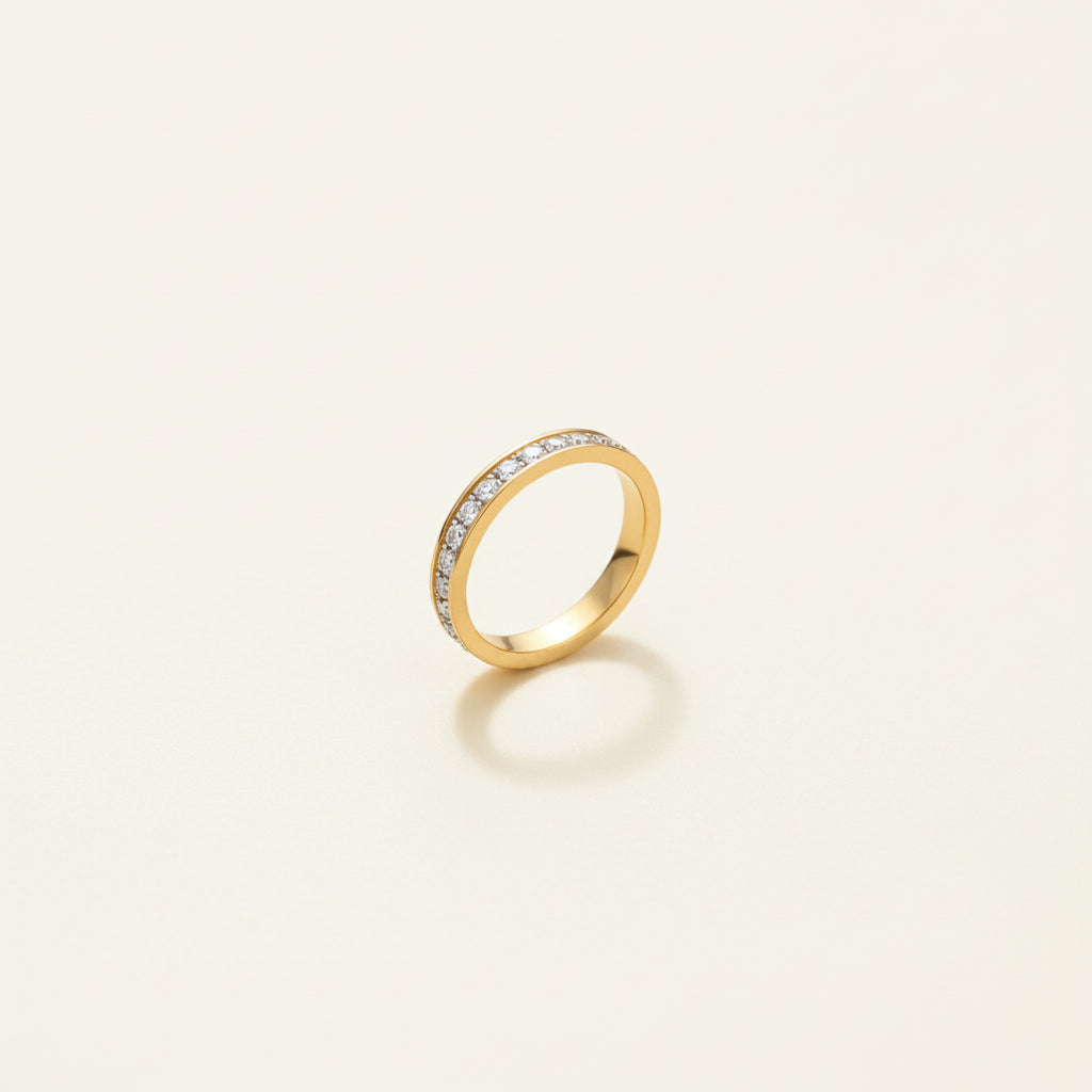 Detailed shot of the high-quality 18K gold plating and the precision-set stones of the Eterna Crystal Band Ring.