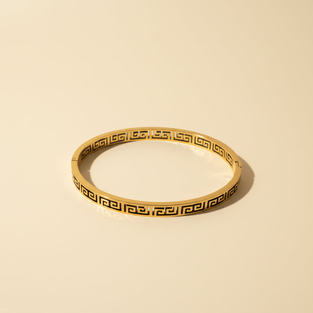 Detailed shot of the secure hidden lock mechanism and the premium gold plating on the Regal Key Bangle.