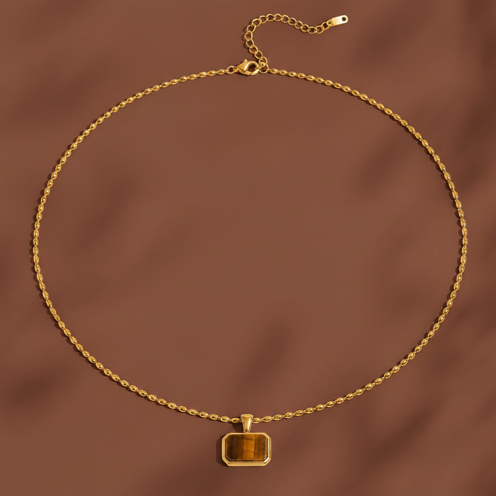 Tiger Eye pendant necklace displayed on a #5b3b3a luxury catalogue background.