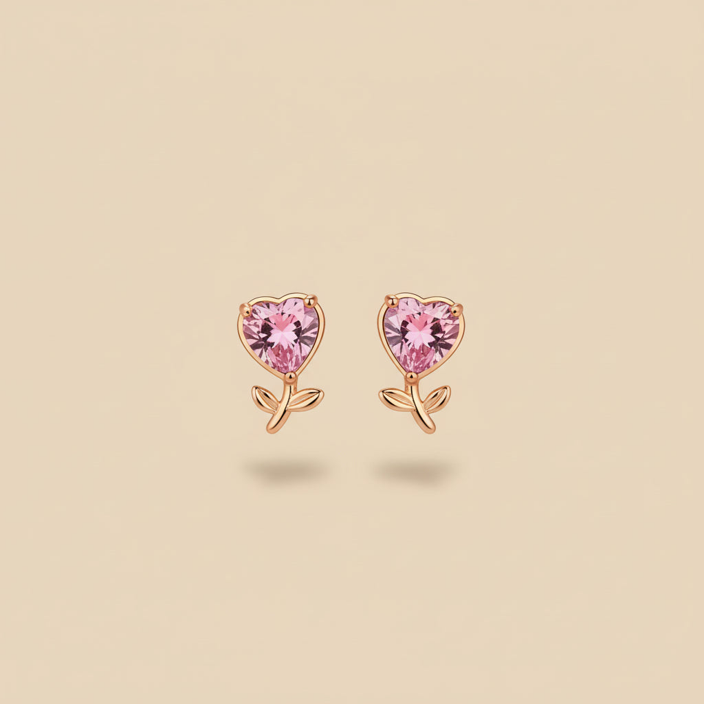 Blush Heart Stud Earrings worn on ear – delicate gold pink heart earrings