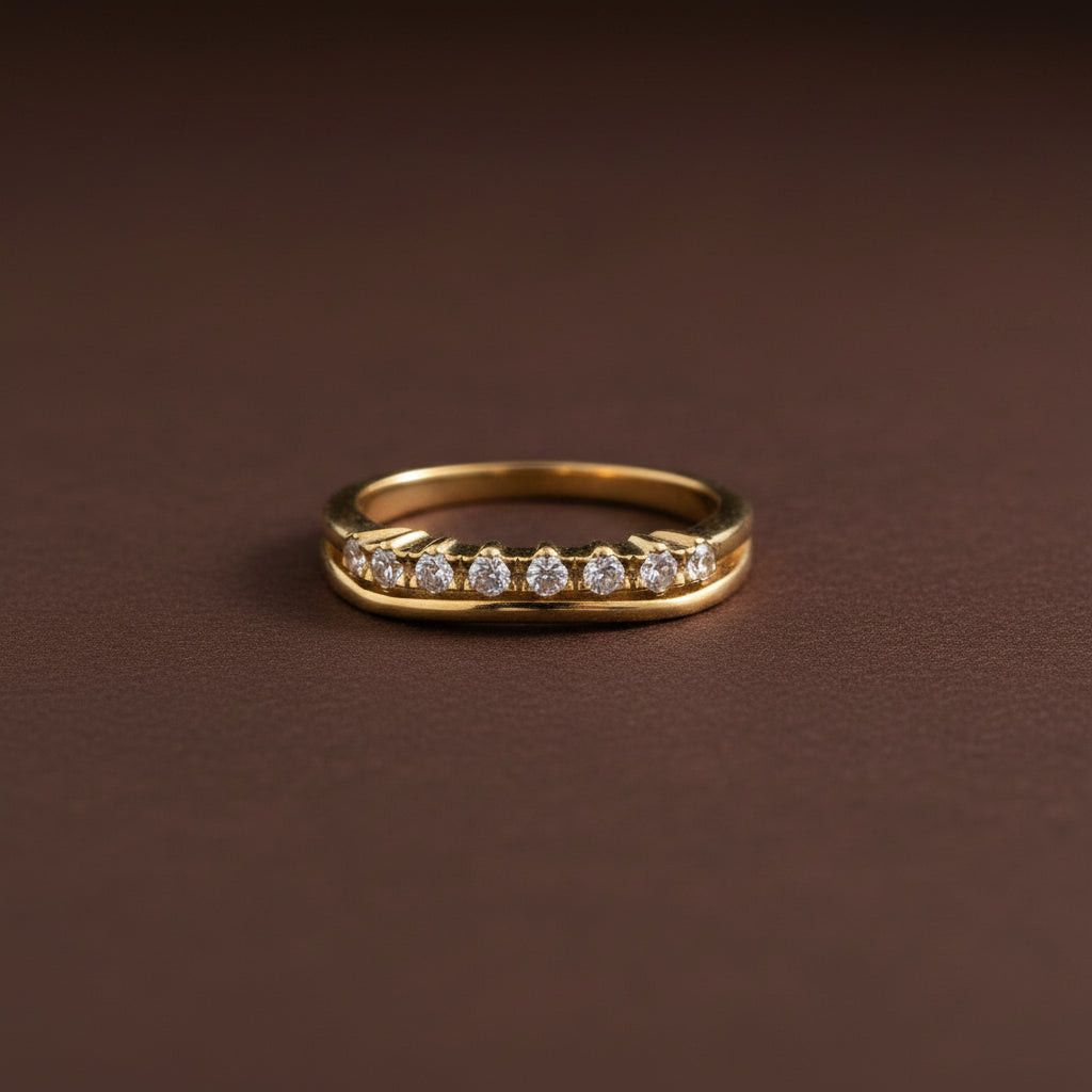 A close-up view of the Celeste Crystal Curve Ring highlighting its unique wave-like silhouette and shimmering crystal pavé.