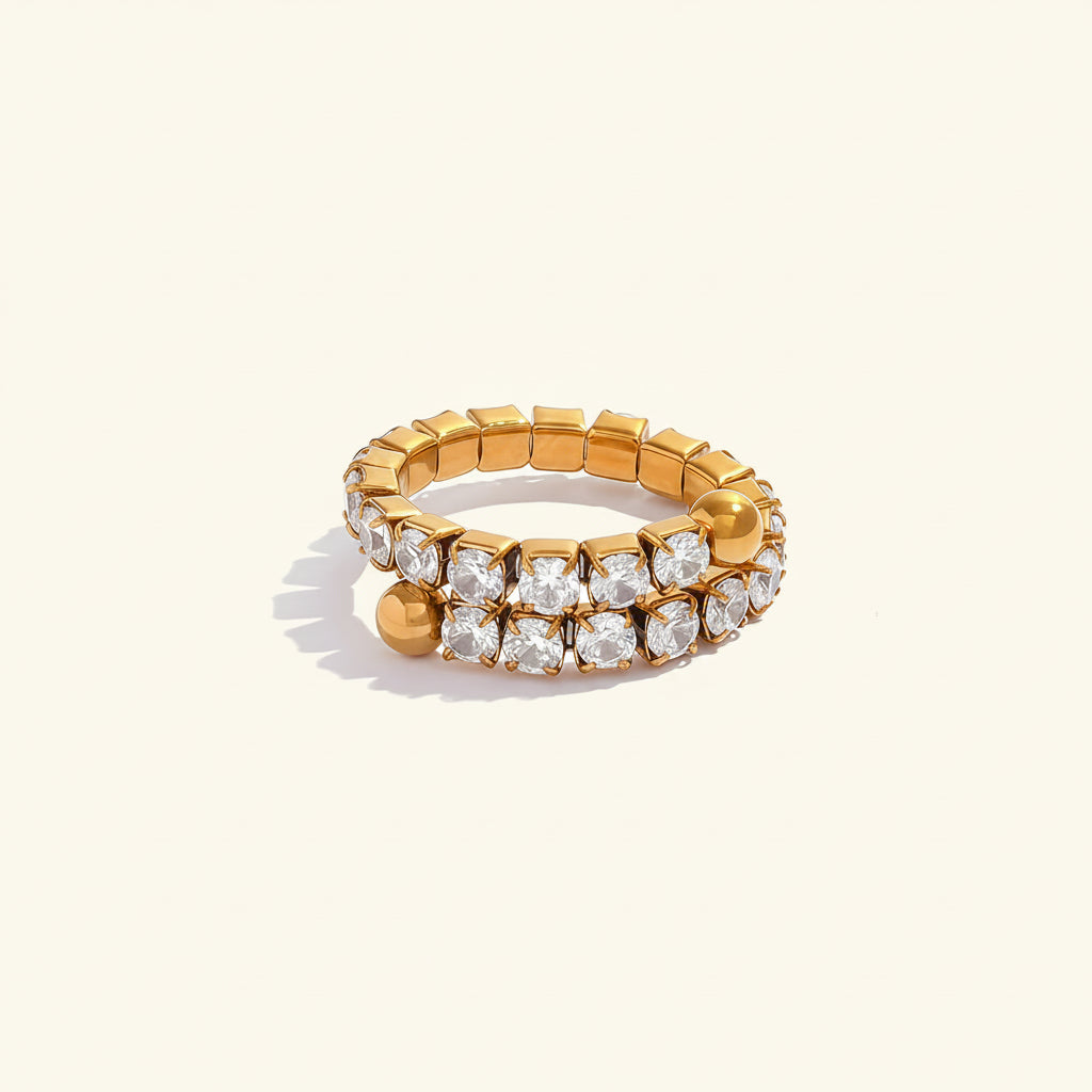 Celeste Lumi Adjustable Ring displayed on a premium cream catalogue background.