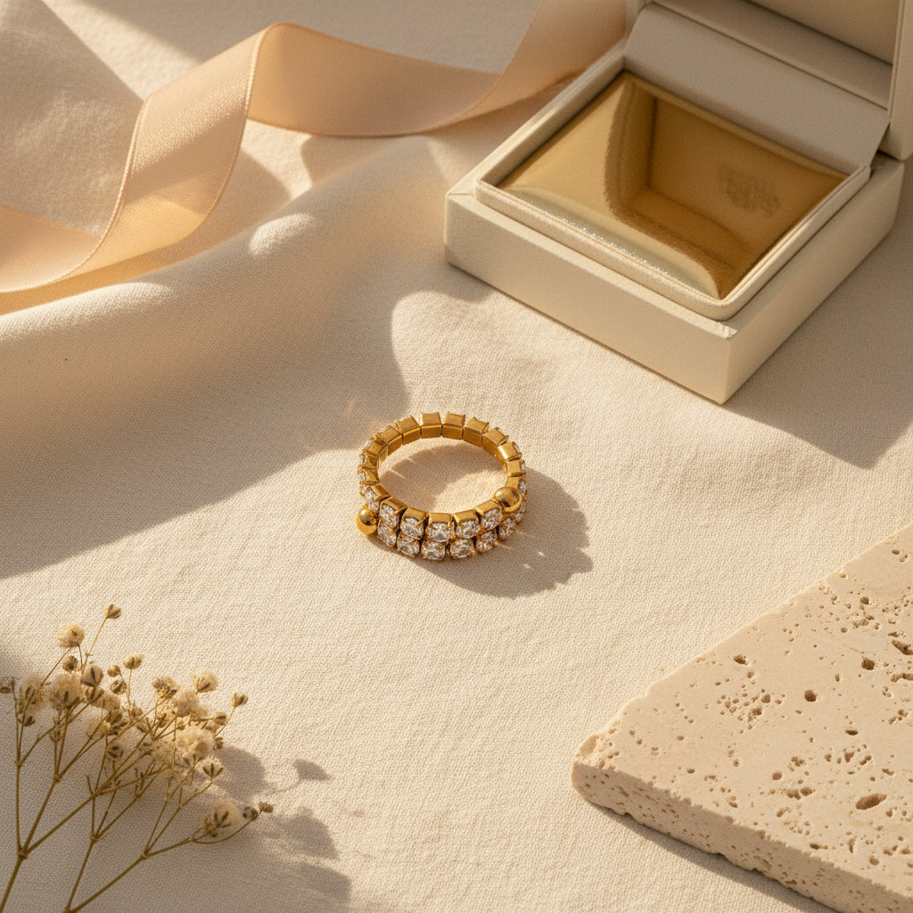 Celeste Lumi Adjustable Ring styled on cream linen with luxury jewellery accessories.