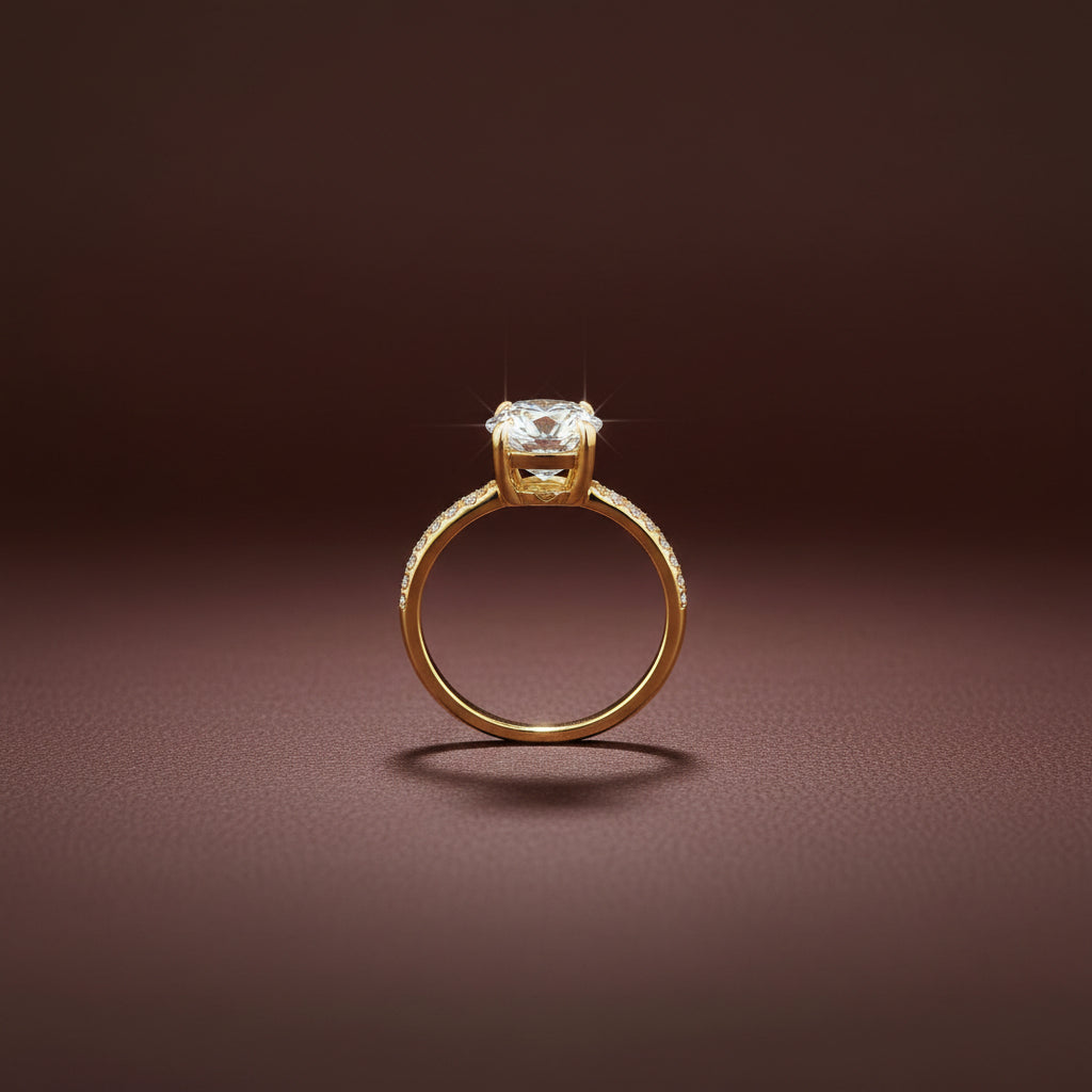 A high-resolution close-up of the Celeste Solitaire Ring highlighting the brilliant-cut stone and polished 18K gold band.