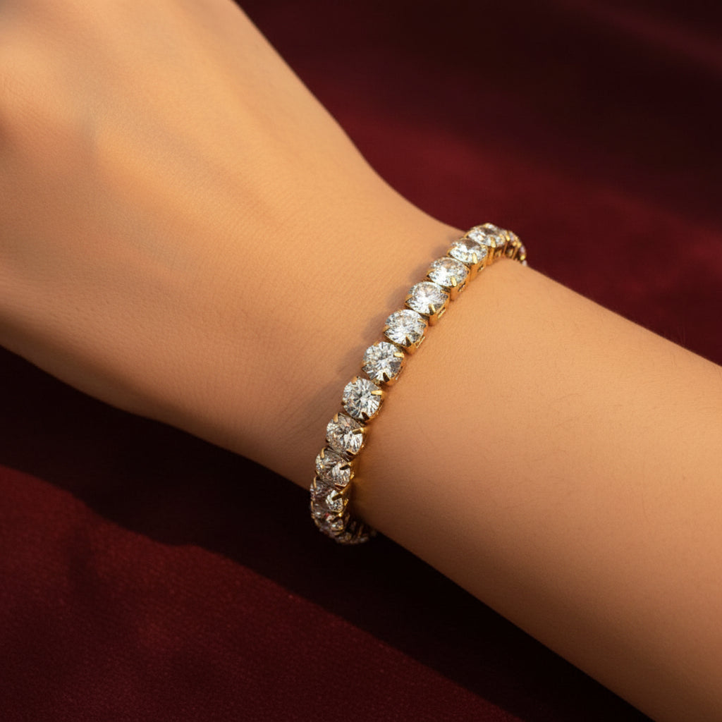 Woman wearing luxury crystal bracelet on wrist, gold jewellery