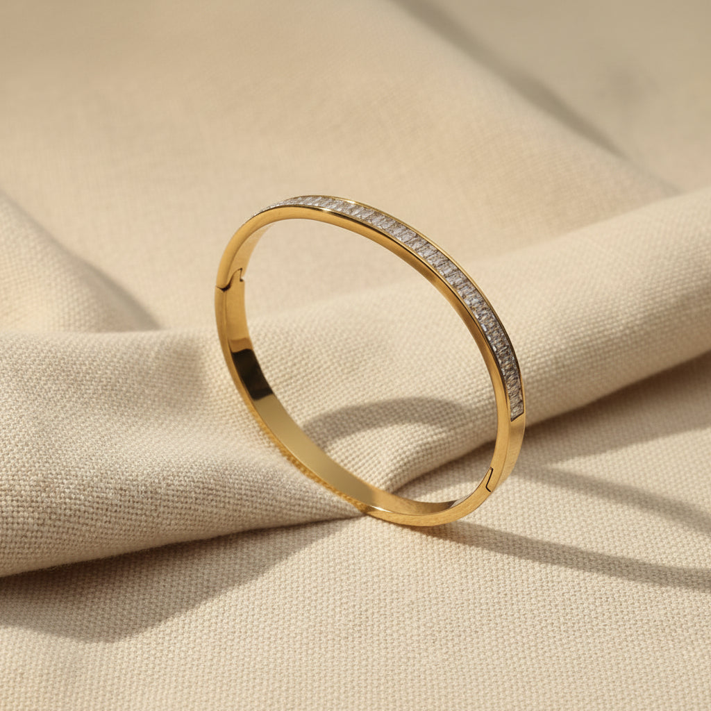 Crystal Gold Bangle Bracelet on fabric – showing sparkling crystal stone detail