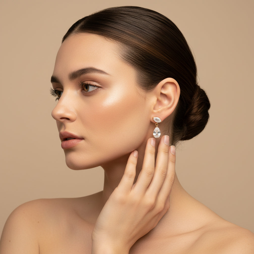 Crystal Teardrop Elegance Earrings worn on ear – gold plated teardrop dangle earrings for women by Swikaar