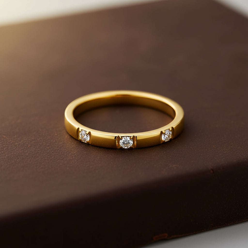 A high-end editorial lifestyle photograph capturing a refreshing luxury aesthetic, with a sharp, clearly visible gold flat edge triple stone ring composed on an appealing food item with a half-visible model playfully posing.