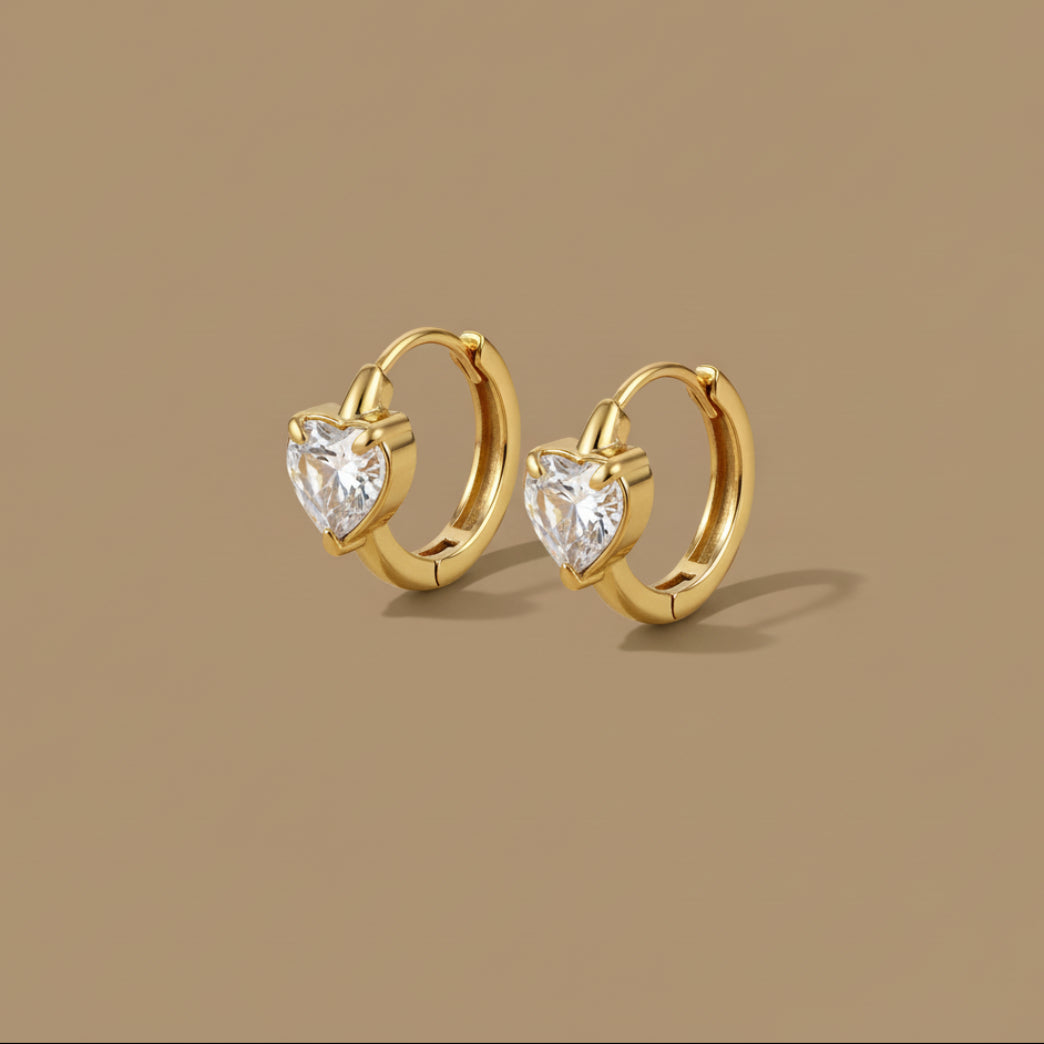 A front-facing view of the Heart Crystal Hoop Earrings showing the sparkling pavé heart charms and gold-plated finish.