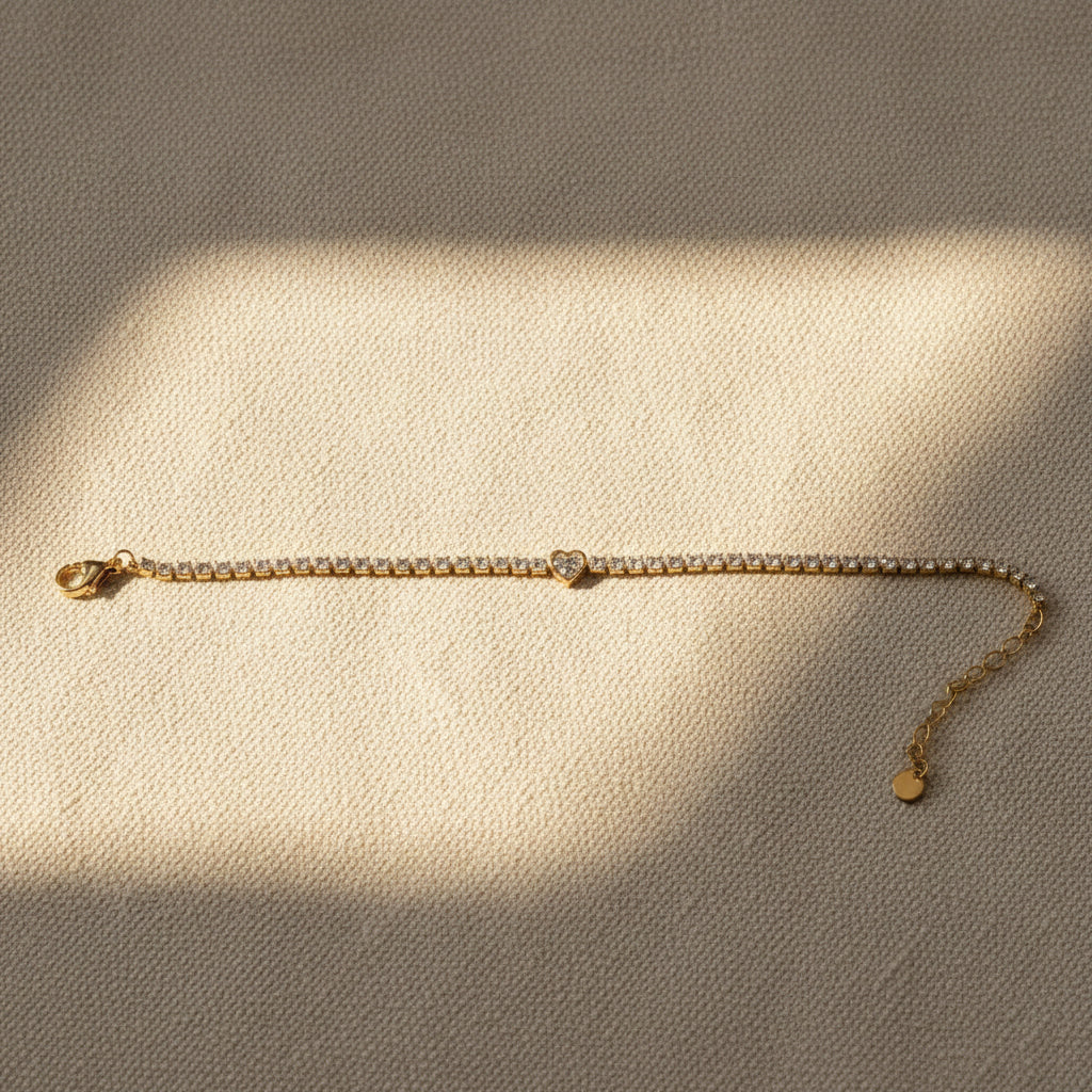 Heart Tennis Bracelet close-up of crystal stone tennis chain and heart-shaped charm detail by Swikaar