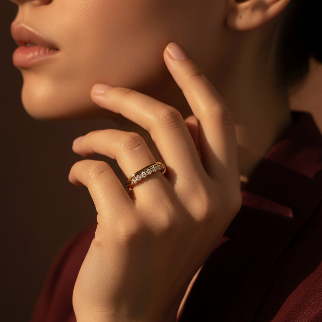A model wearing the Celeste Crystal Curve Ring to showcase how the organic shape contours the finger with a radiant glow.