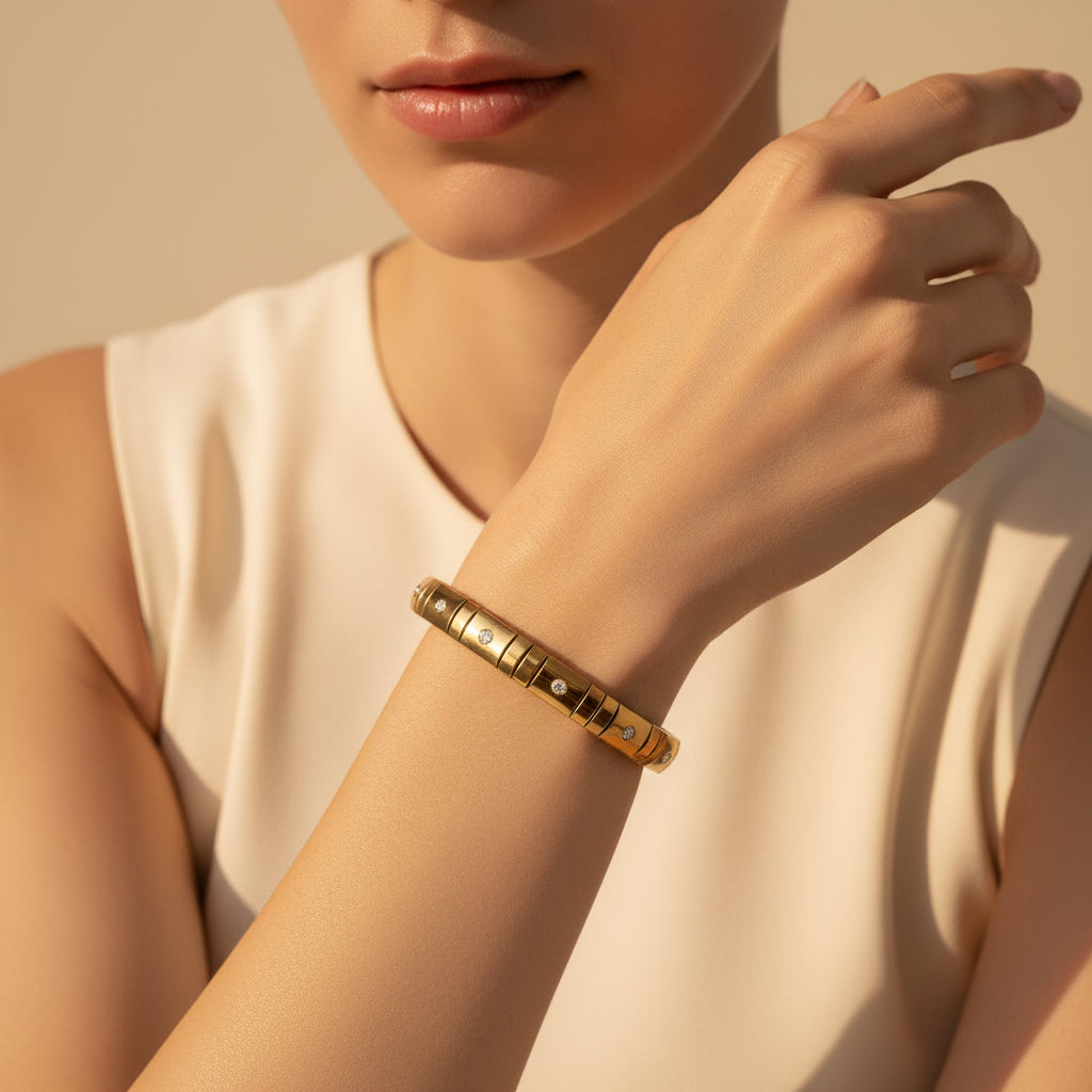 A model wearing the Celestia Glissade Bracelet to showcase its flexible fit and radiant shimmer on the wrist.