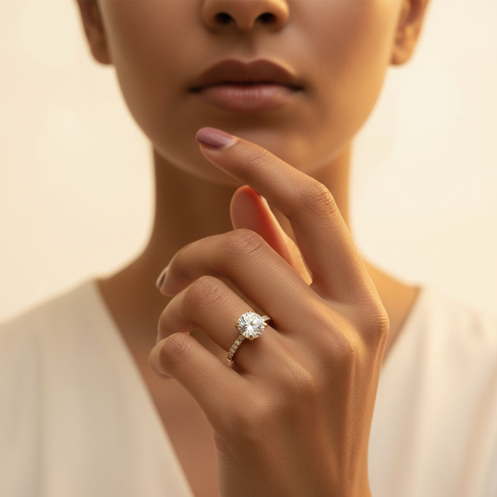 A model wearing the Celeste Solitaire Ring to showcase its elegant sparkle and minimalist profile on the finger.