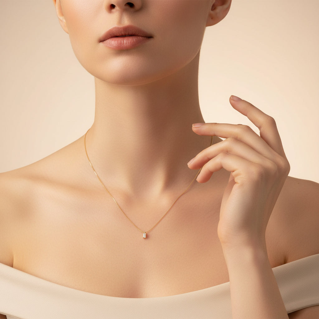 Mini Baguette Pendant Necklace close-up of baguette-cut cubic zirconia stone in gold plated setting