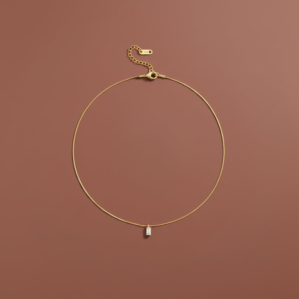 Mini Baguette Pendant Necklace front view showing rectangular baguette stone on fine gold chain