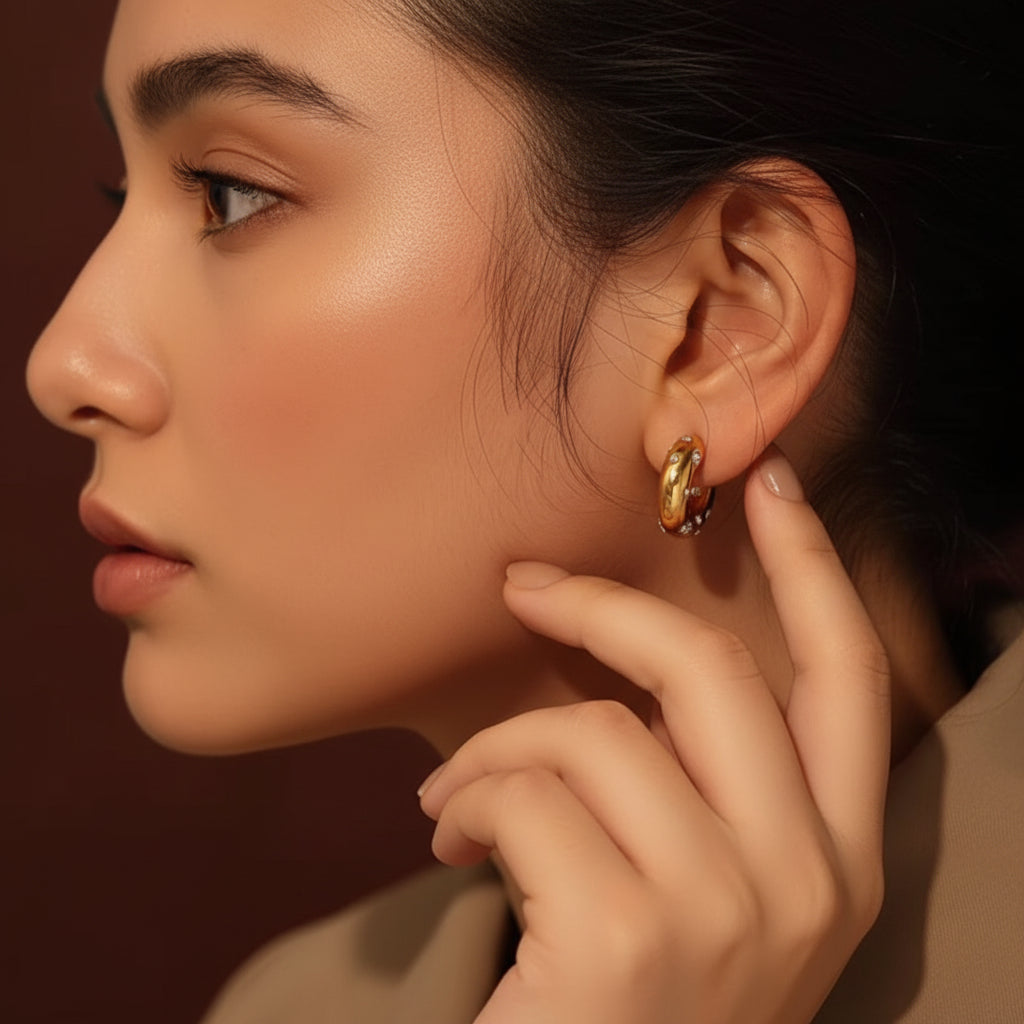 Woman wearing Nova Pavé Link Hoop Earrings with focus on the sparkling link design.