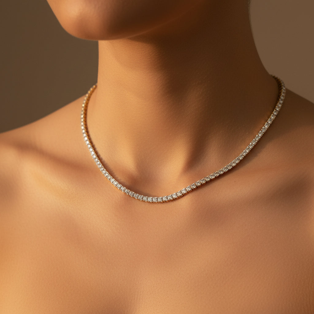 A close-up view of the Premium Tennis Chain Necklace featuring sparkling Swarovski crystals and a gold-plated finish.