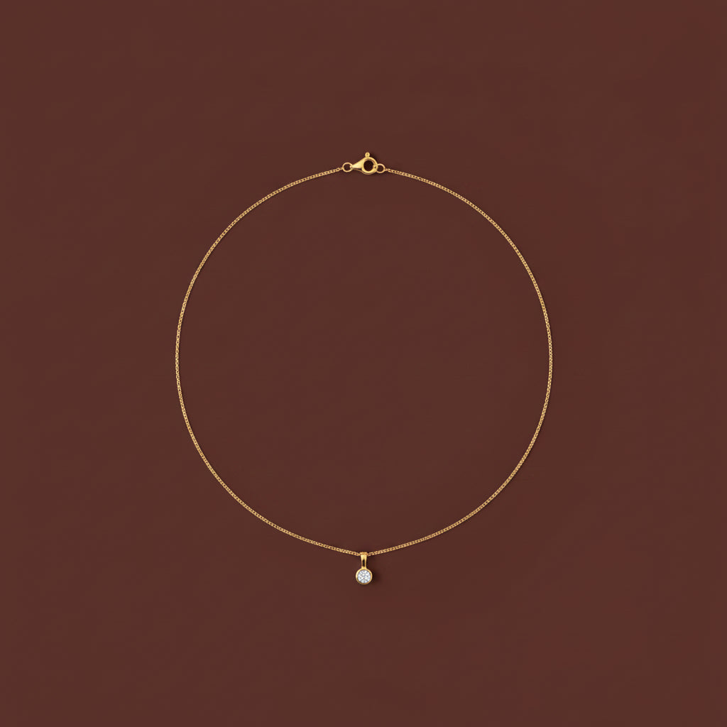 A professional flat-lay catalogue image showing the 18K gold round crystal bezel necklace arranged in a precise circle with soft shadows on a rich cocoa brown background.