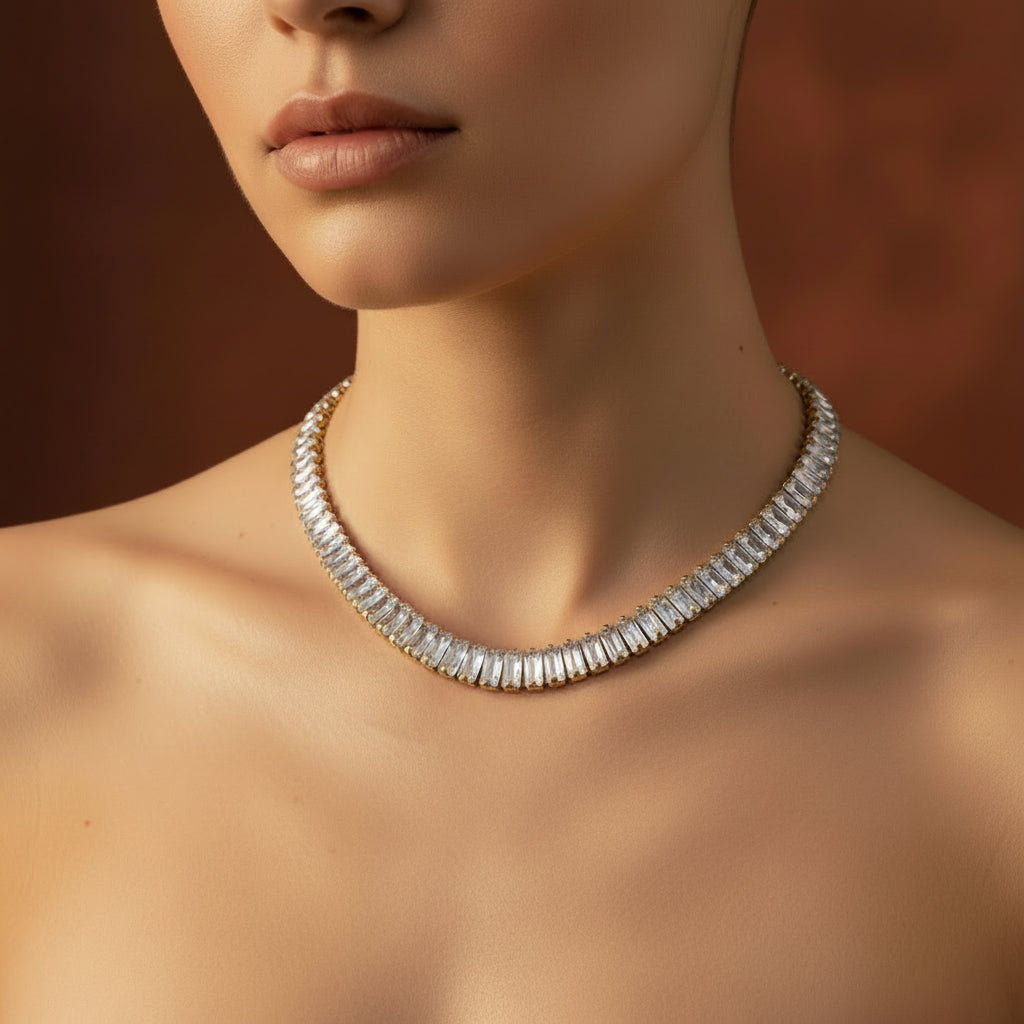 A close-up view of the Rusty Gold Tennis Necklace highlighting the baguette-cut stones and antique-tone gold finish.