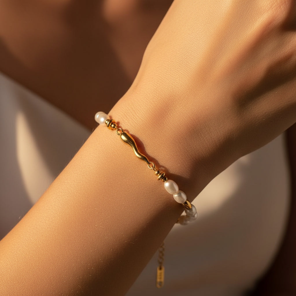 sculptural-gold-pearl-bracelet-women-model-hand-zoomed