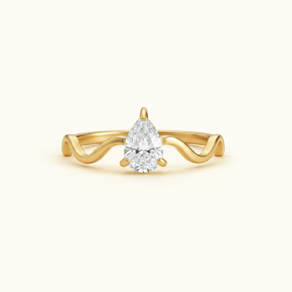 Serena Wave Pear Ring on a premium cream catalogue background showcasing the wave band design.
