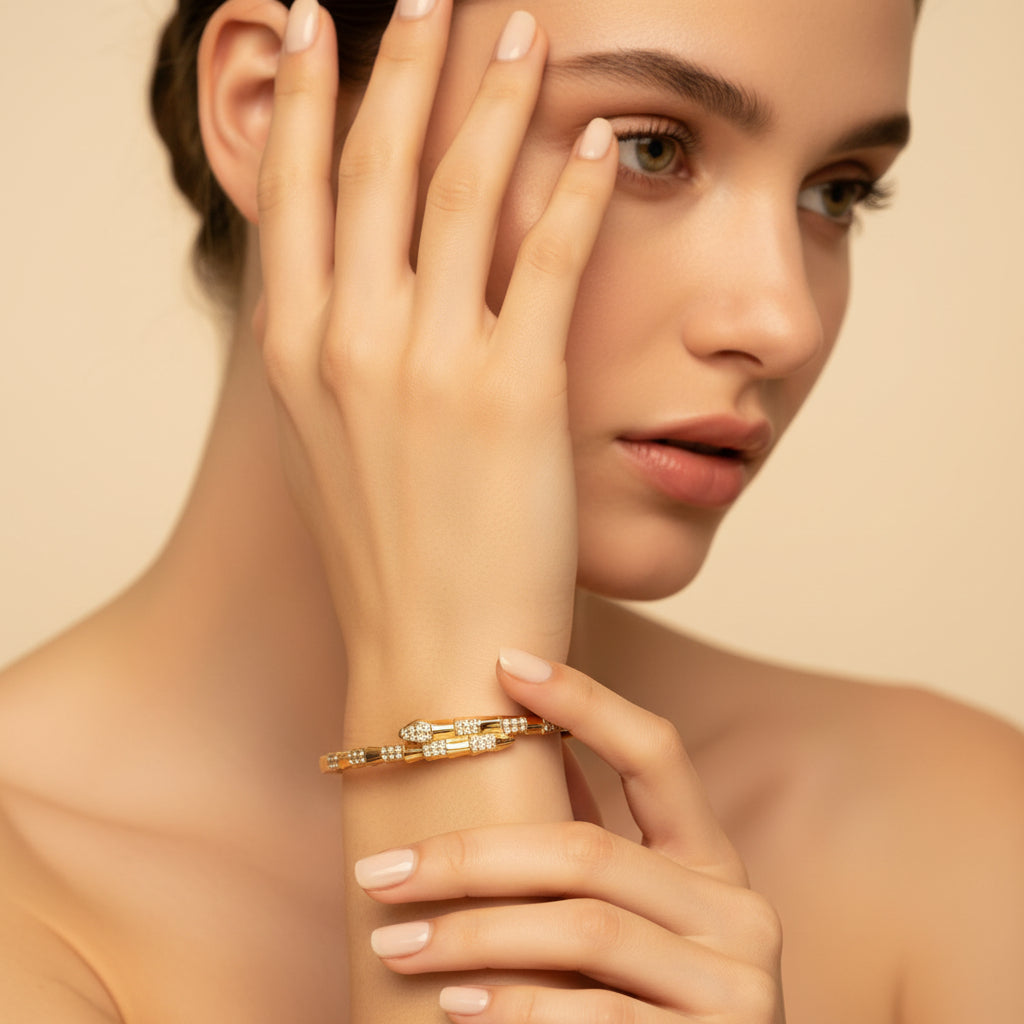 Gold bracelet with small diamonds on a white cushion