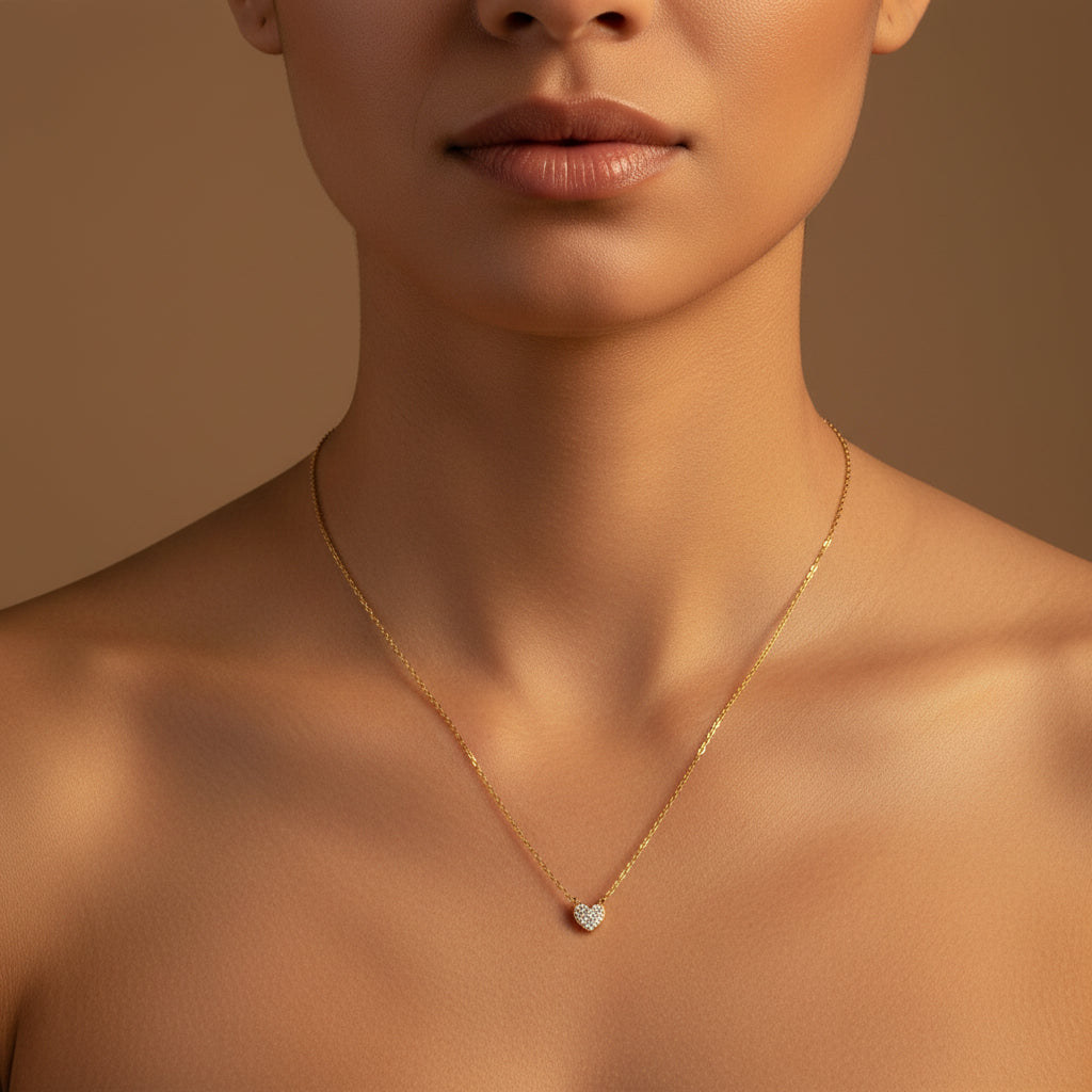 A close-up view of the Sparkling Heart Pendant Necklace highlighting the brilliant pavé crystal setting and gold-plated chain.