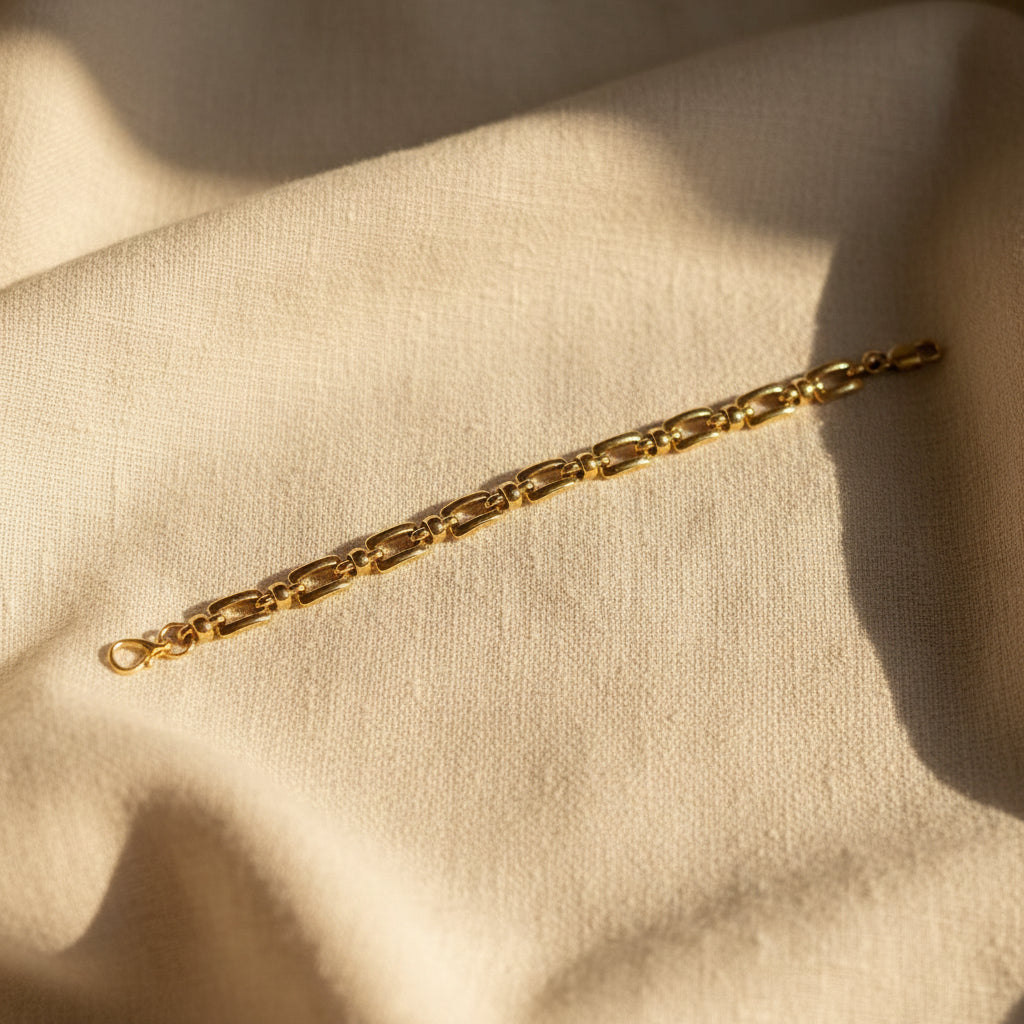 Structured Link Bracelet close-up of rectangular gold link chain detail and clasp