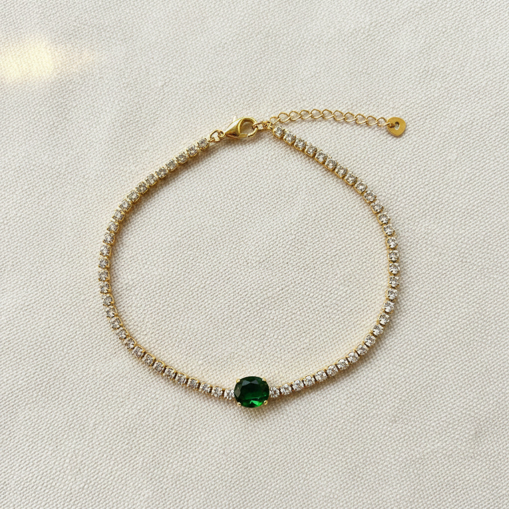 The Green Stone Tennis Bracelet presented in a luxury Swikaar box, highlighting its appeal as a premium gift for women.