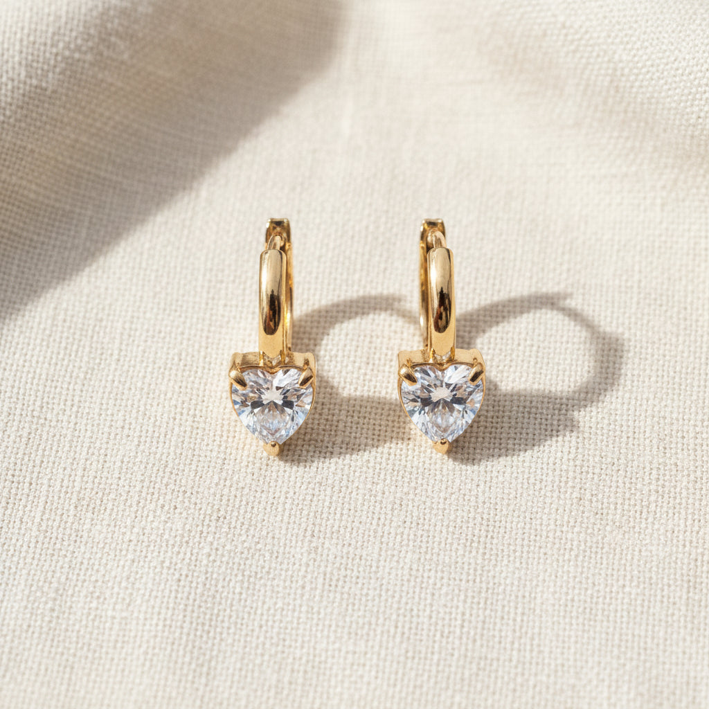 The Heart Crystal Hoop Earrings presented in a premium Swikaar jewelry box, perfect for gifting.