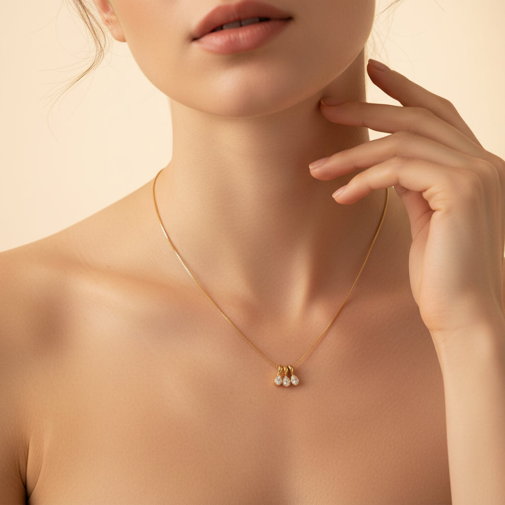 Trio Drop Charm Necklace close-up of three crystal charm pendants in gold plated setting