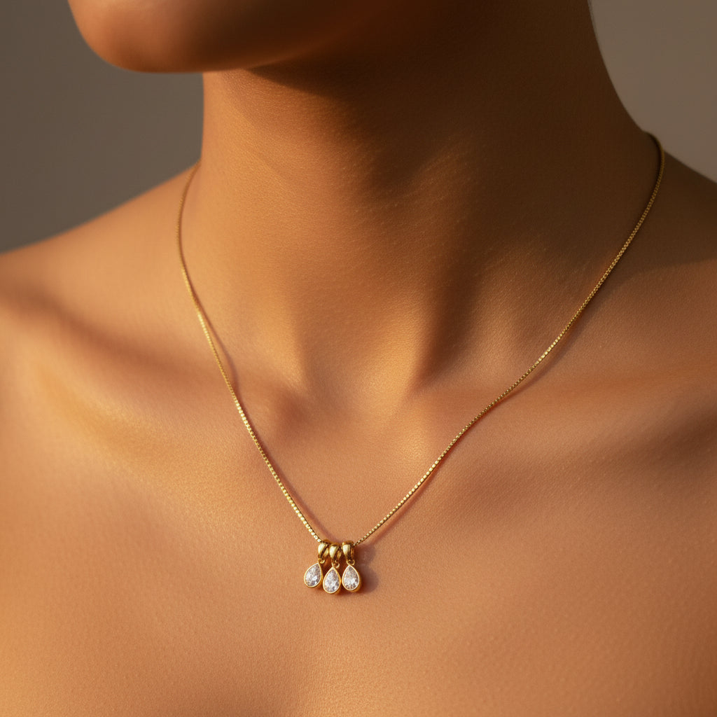 Trio Drop Charm Necklace front view showing three sparkling crystal charms at varying drop lengths