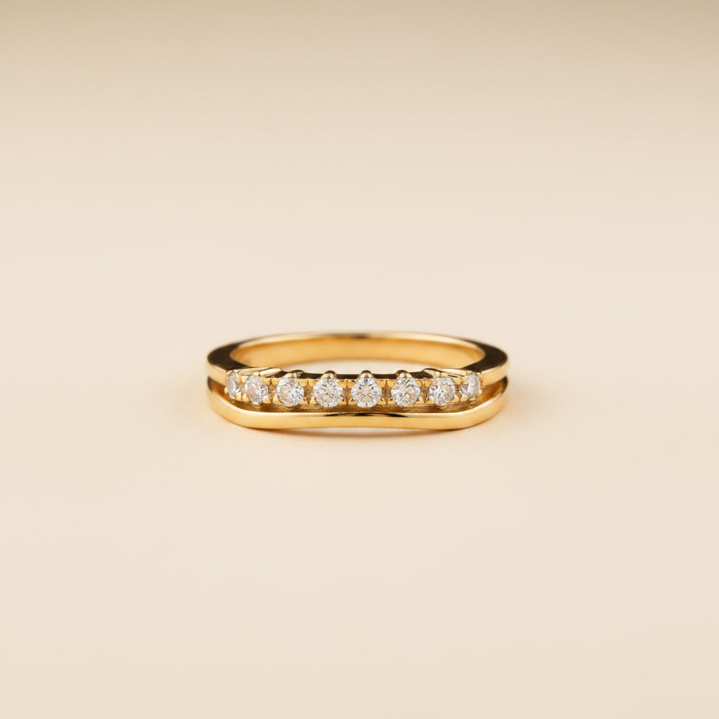 Detailed shot of the high-quality 18K gold plating and the precision stone setting on the Celeste Crystal Curve Ring.