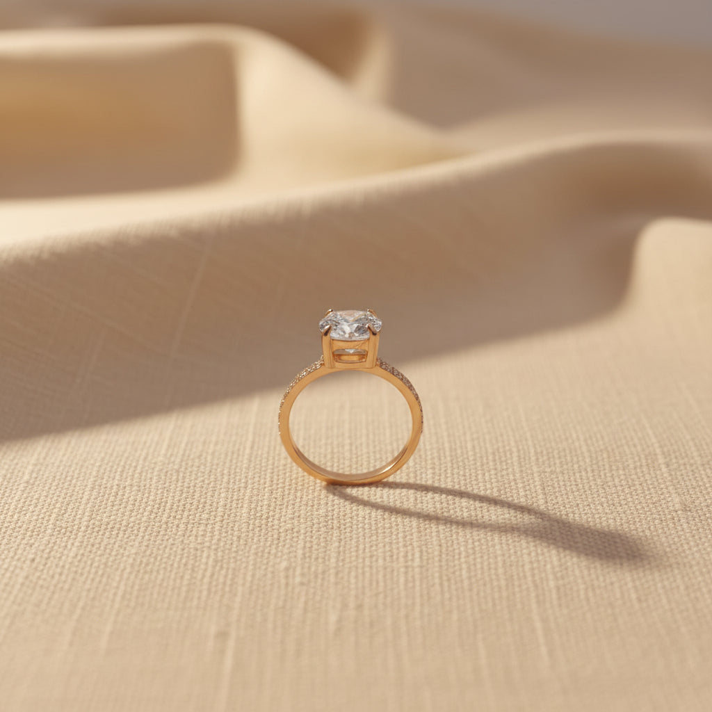 Detailed shot of the high-quality 18K gold plating and the secure four-prong setting of the Celeste Solitaire Ring.