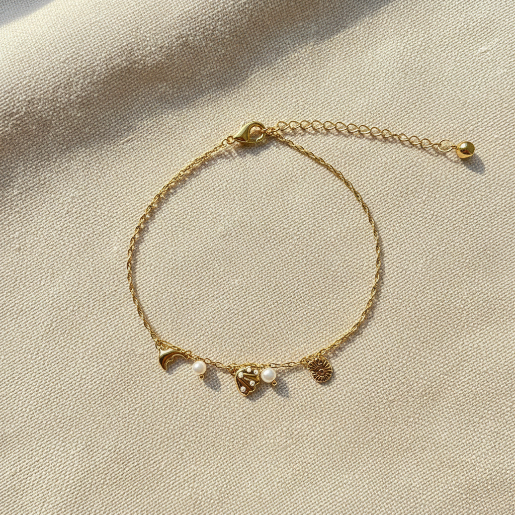 Close-up of the high-quality 18K gold plating and secure lobster clasp on the ocean-inspired charm bracelet.