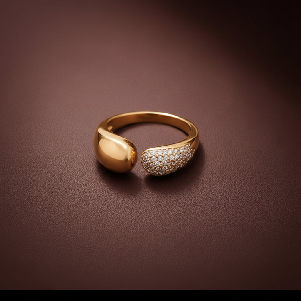 A detailed close-up of the Aurea Dual Luxe Ring highlighting the parallel polished gold and crystal-encrusted bands.
