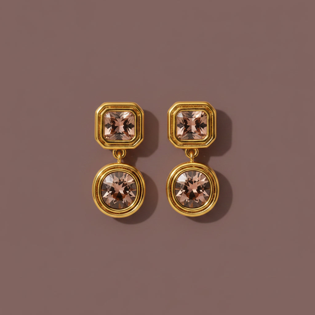 Celeste Champagne Drop Earrings with champagne Cubic Zirconia on a luxury catalogue background.