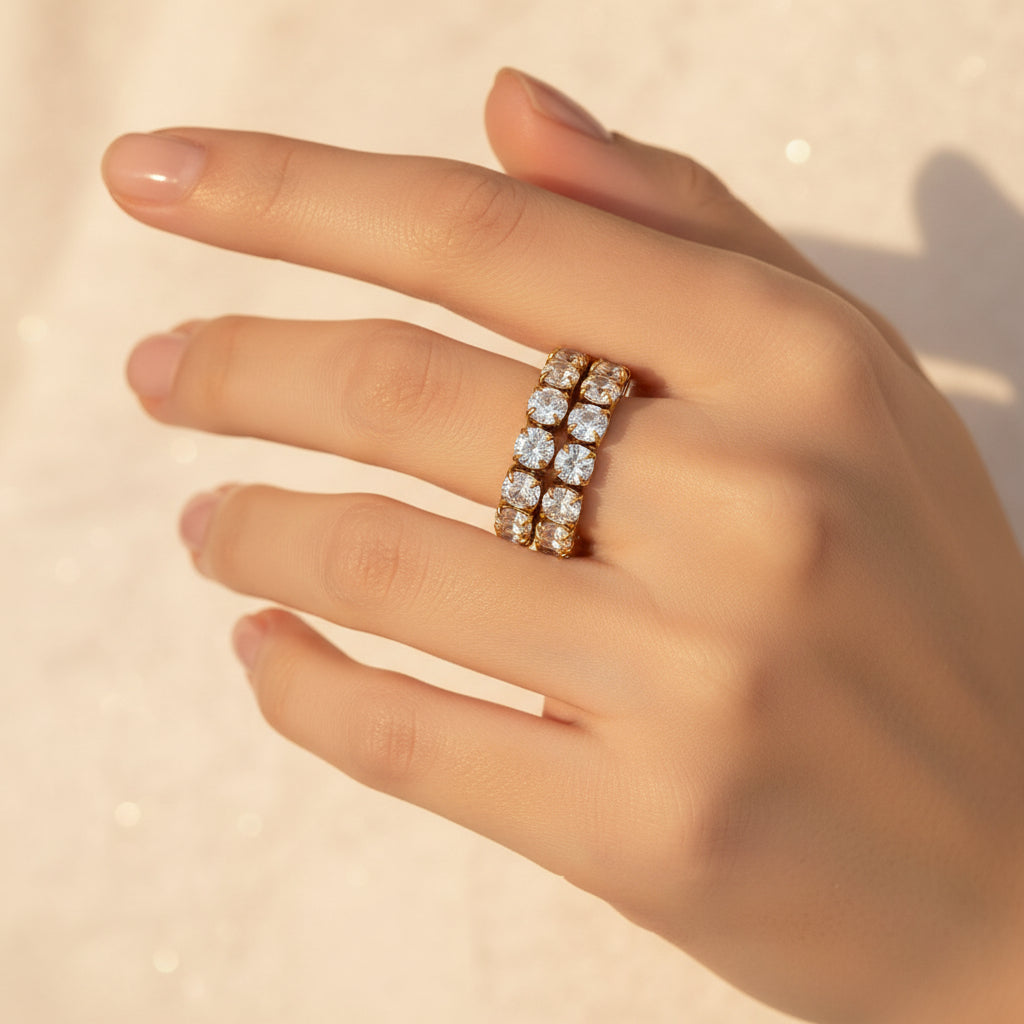 Elegant female model wearing the Celeste Lumi Adjustable Ring against a premium cream background.