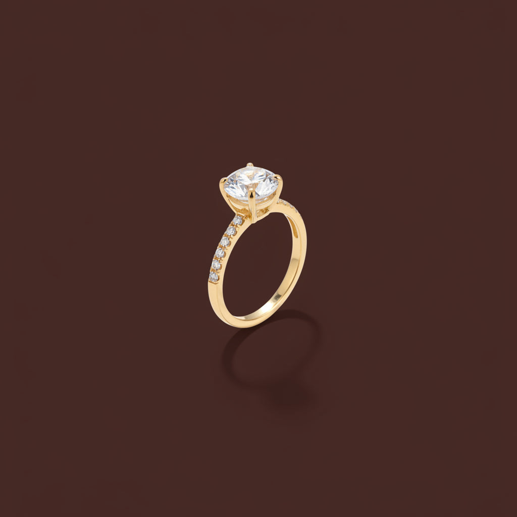 A high-resolution close-up of the Celeste Solitaire Ring highlighting the brilliant-cut stone and polished 18K gold band.