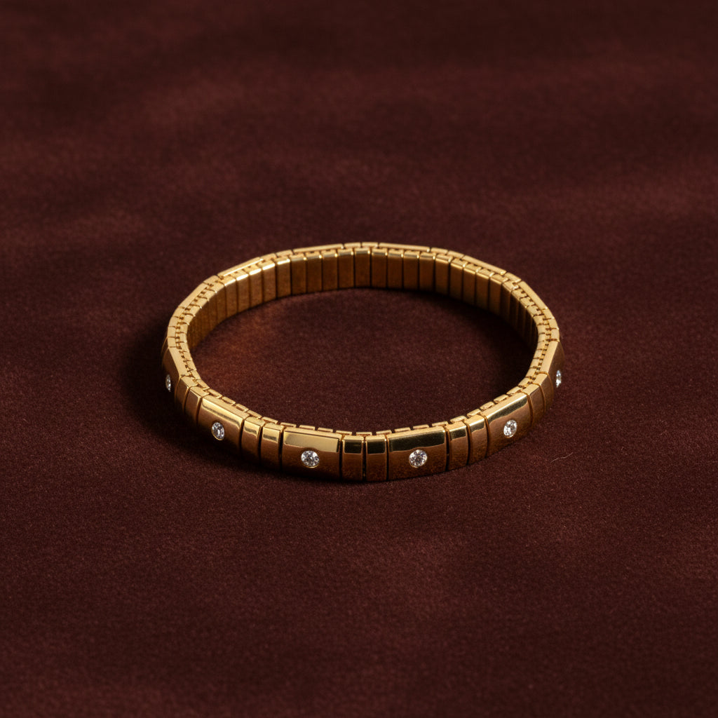 A close-up view of the Celestia Glissade Bracelet highlighting the flexible gold setting and continuous line of brilliant crystals.