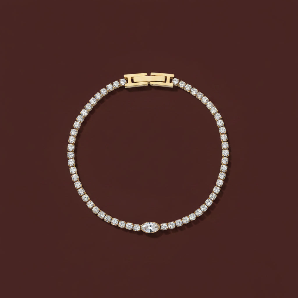 A close-up view of the Celestia Tennis Bracelet highlighting the continuous row of shimmering crystals and the polished 18K gold finish.