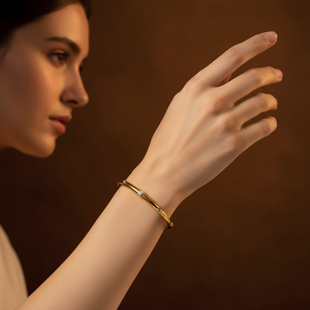 Gold Classic Spark Bangle side view showing embedded crystal stone detailing bracelet on a white foam block