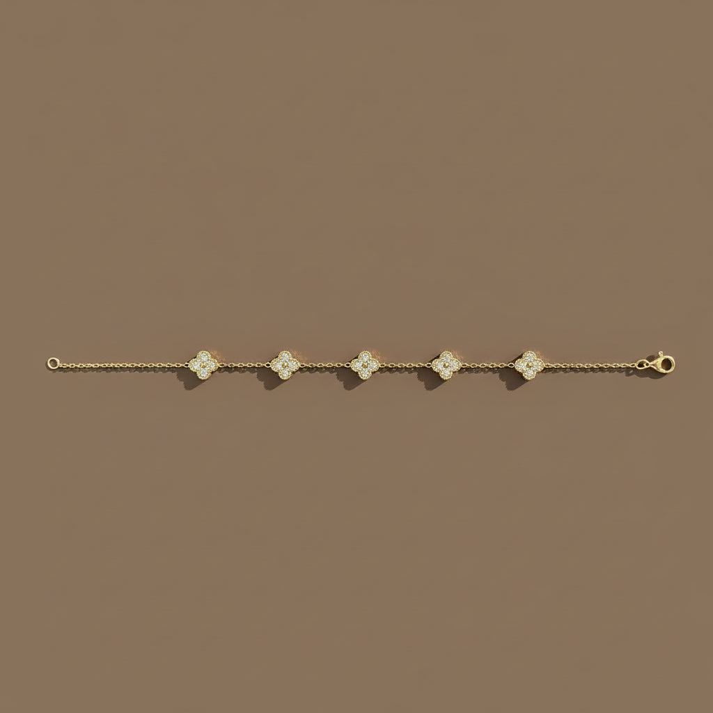 Clover Luxe Charm Bracelet flat lay on fabric – gold clover charm jewellery by Swikaar