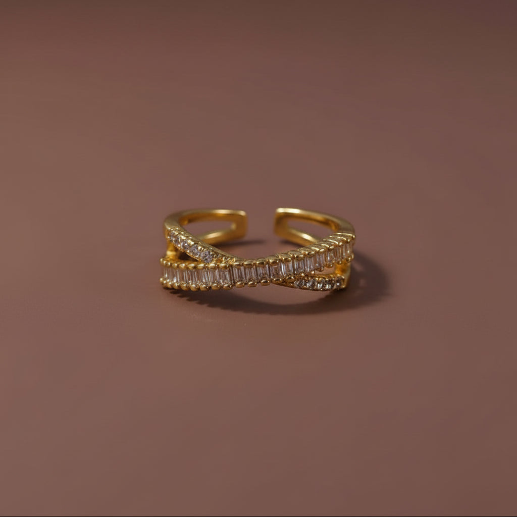 18K gold plated adjustable criss-cross CZ ring for women on a luxury catalogue background