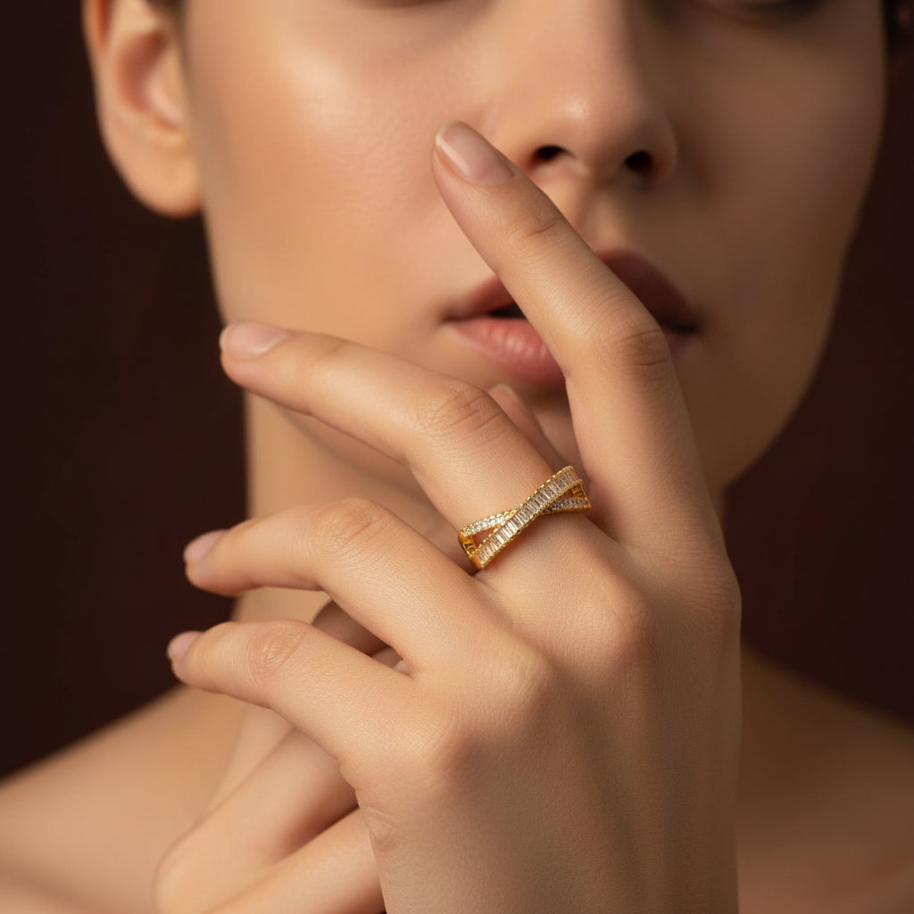 Woman wearing Crossed Paths Adjustable Ring with focus on gold CZ ring styling