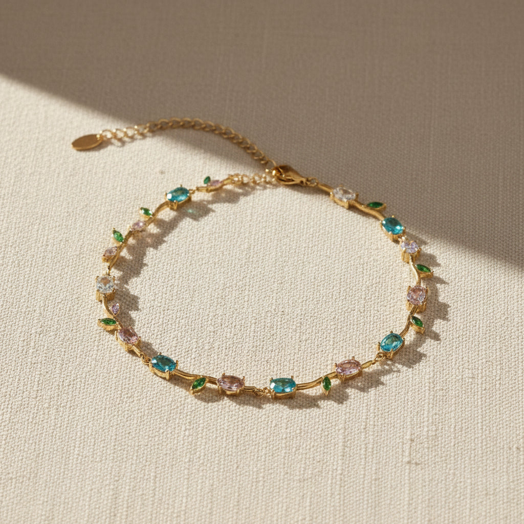 Delicate Floral Bracelet close-up of floral vine detail and multi-colour crystal stones in gold plated setting