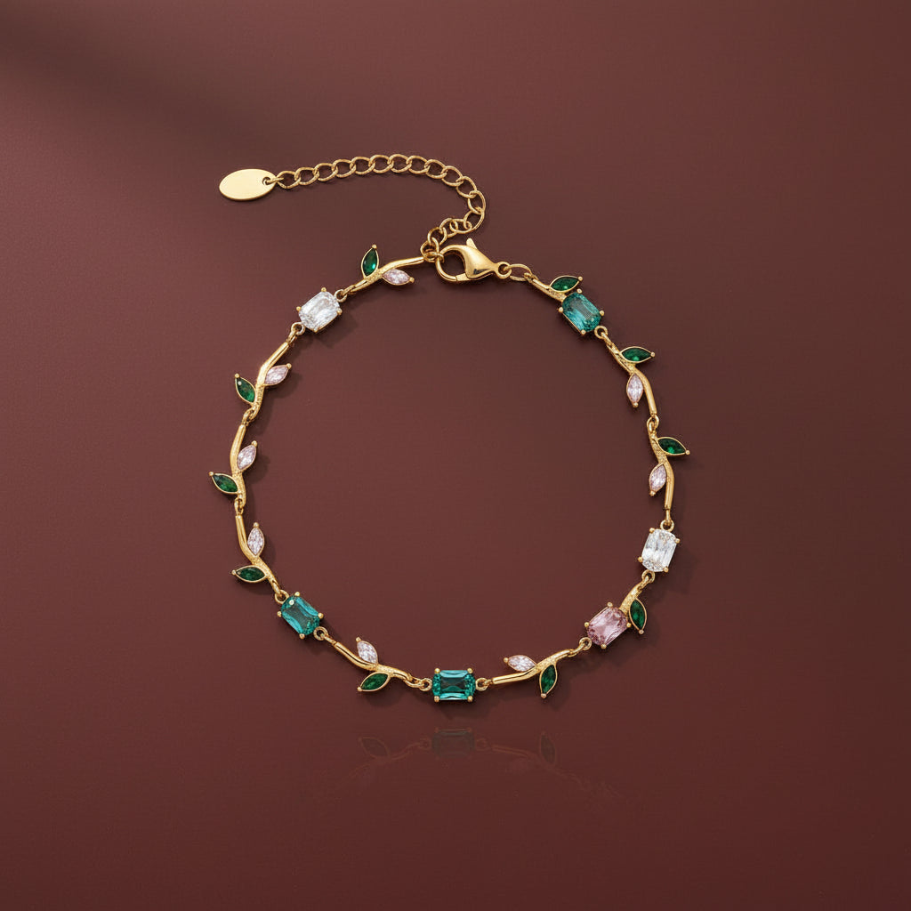 Gold bracelet with gemstones on a brown background