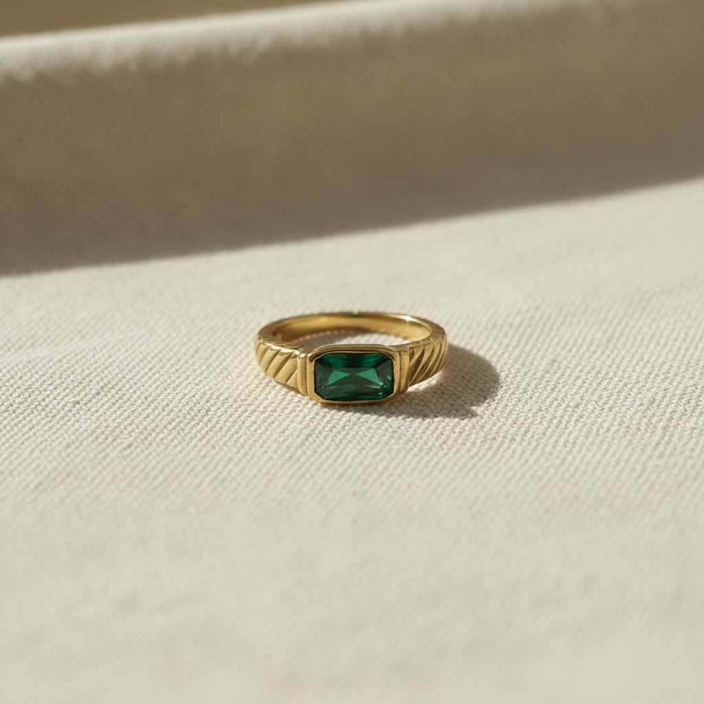 Emerald Royale Statement Ring close-up of emerald green crystal stone in gold plated ornate setting