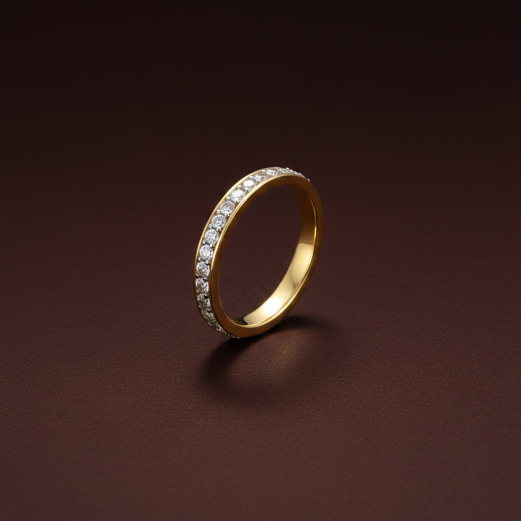 A close-up view of the Eterna Crystal Band Ring highlighting the continuous row of brilliant crystals and 18K gold finish.