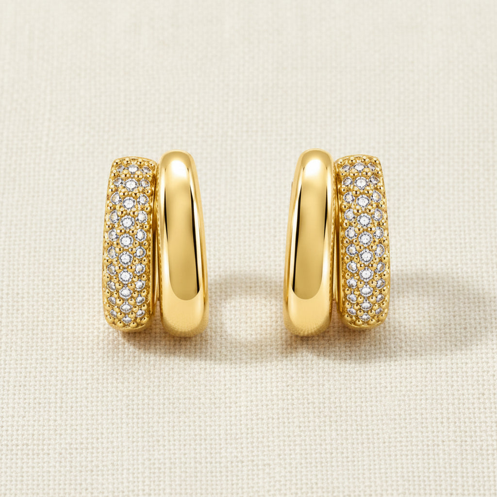 A professional standing catalogue view of the 18K gold plated parallel double hoop crystal earrings with simple shadows on a clean white background.